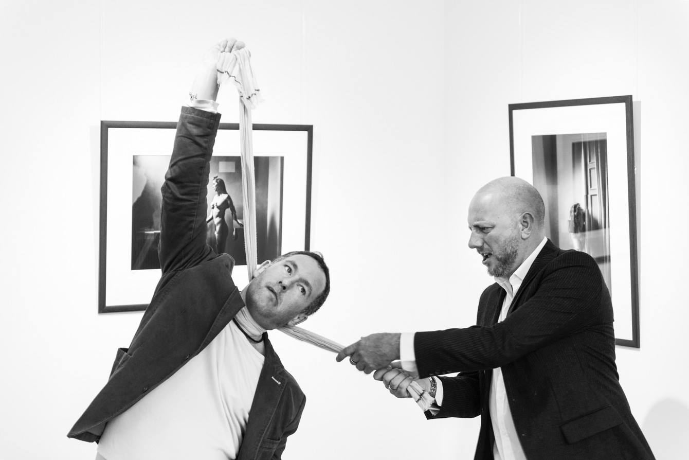 Paul Bock photographs Lee Howell and Chris Close at Urbane Art Gallery during the Retina Opening.